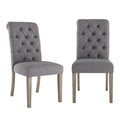Chaises capitonnées à dossier roulé
